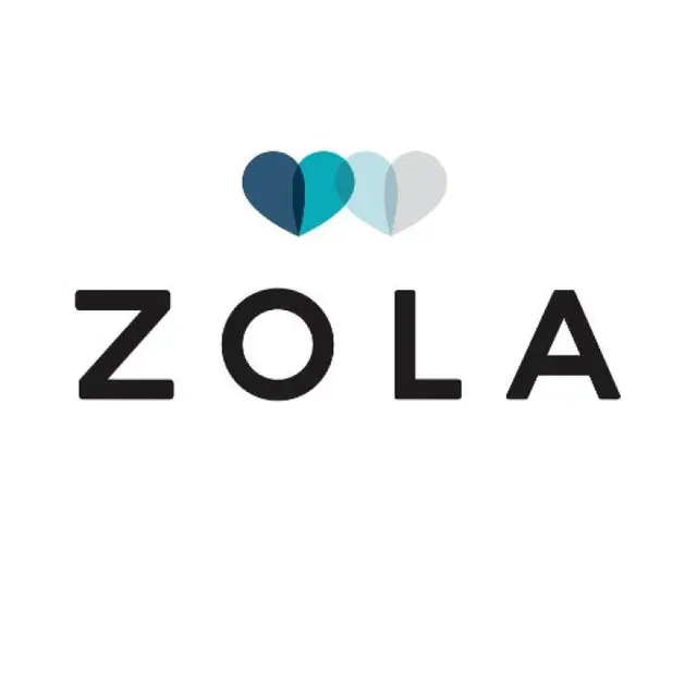 The image shows the logo for "ZOLA," which consists of the word "ZOLA" in uppercase letters with three stylized hearts placed above the letter 'Z'.