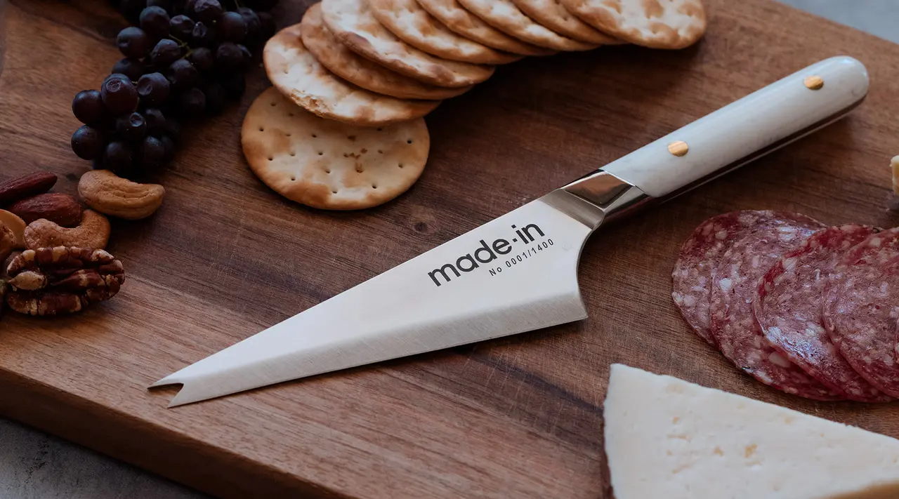 cheese knife on cheese board