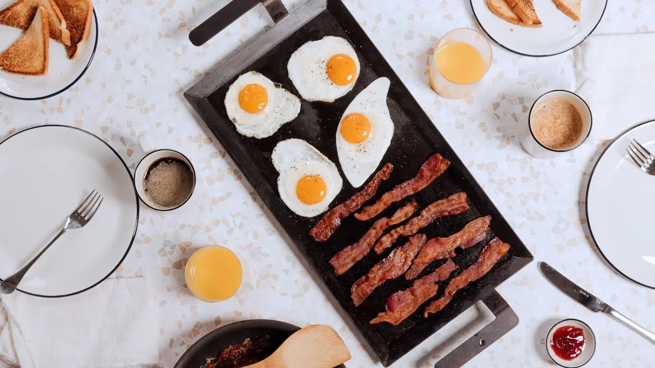 griddle with bacon and eggs